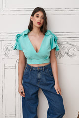 Bluza bleu-turquoise cu funde aplicate pe maneci