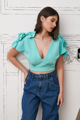 Bluza bleu-turquoise cu funde aplicate pe maneci